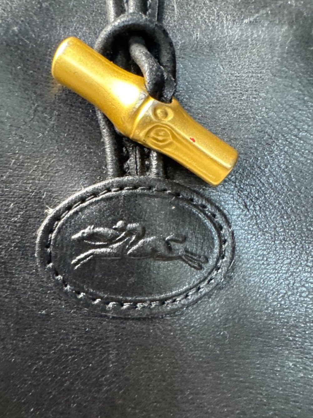Vintage Longchamp Black Leather Drawstring Bucket Bag With Brass Accents - Picture 2 of 14